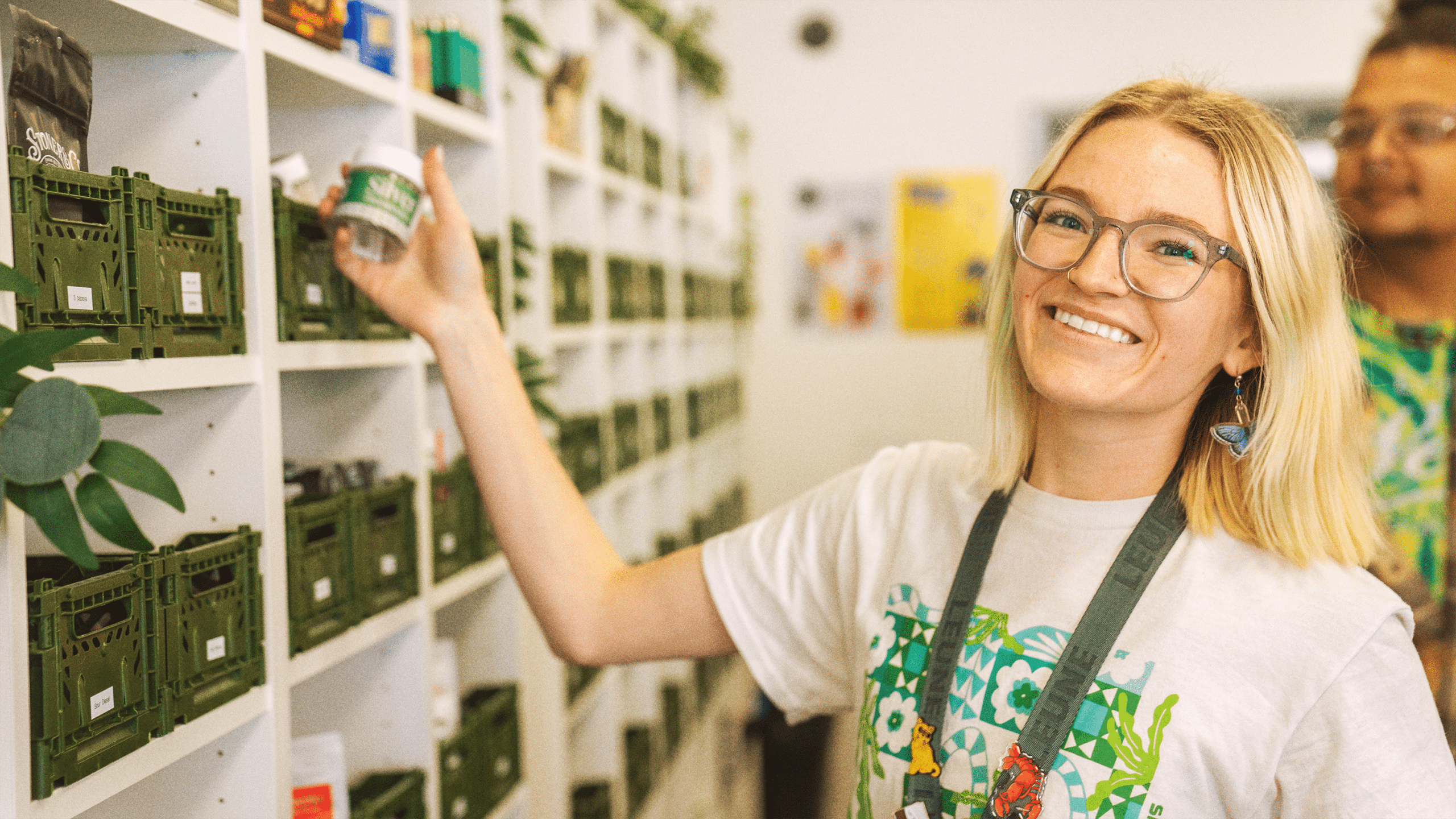 image of budtender smiling and ready to help