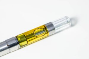 Full gram cartridge of cannabis oil extract and terpenes. Marijuana vape pen is an alternative method of smoking and consuming marijuana.