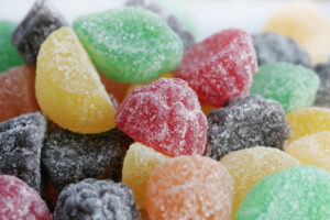 coloureful jelly beans close up over white