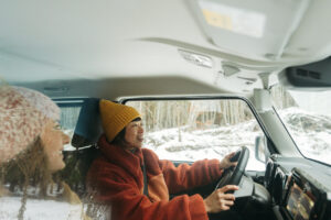Couple of female friends on a winter road trip