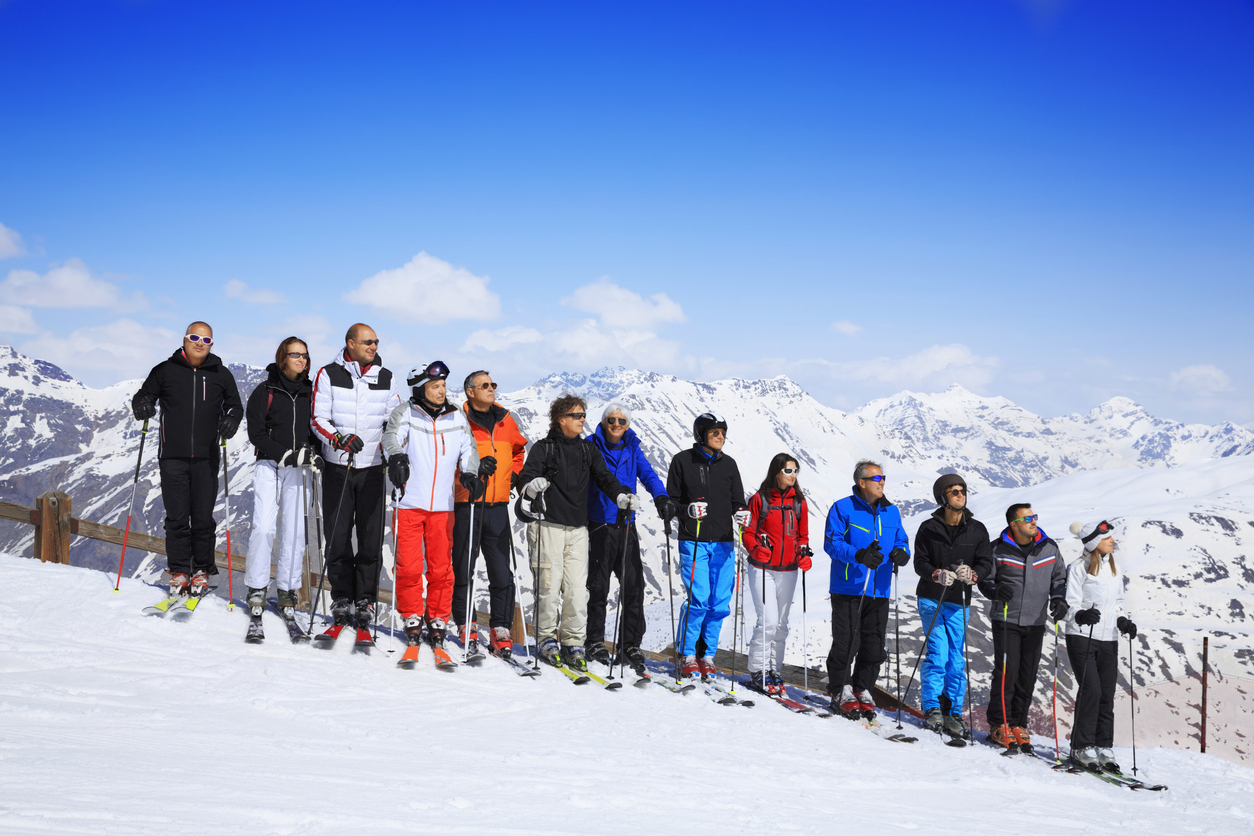 Ski club school skiing trips Colorful group of snow skiers