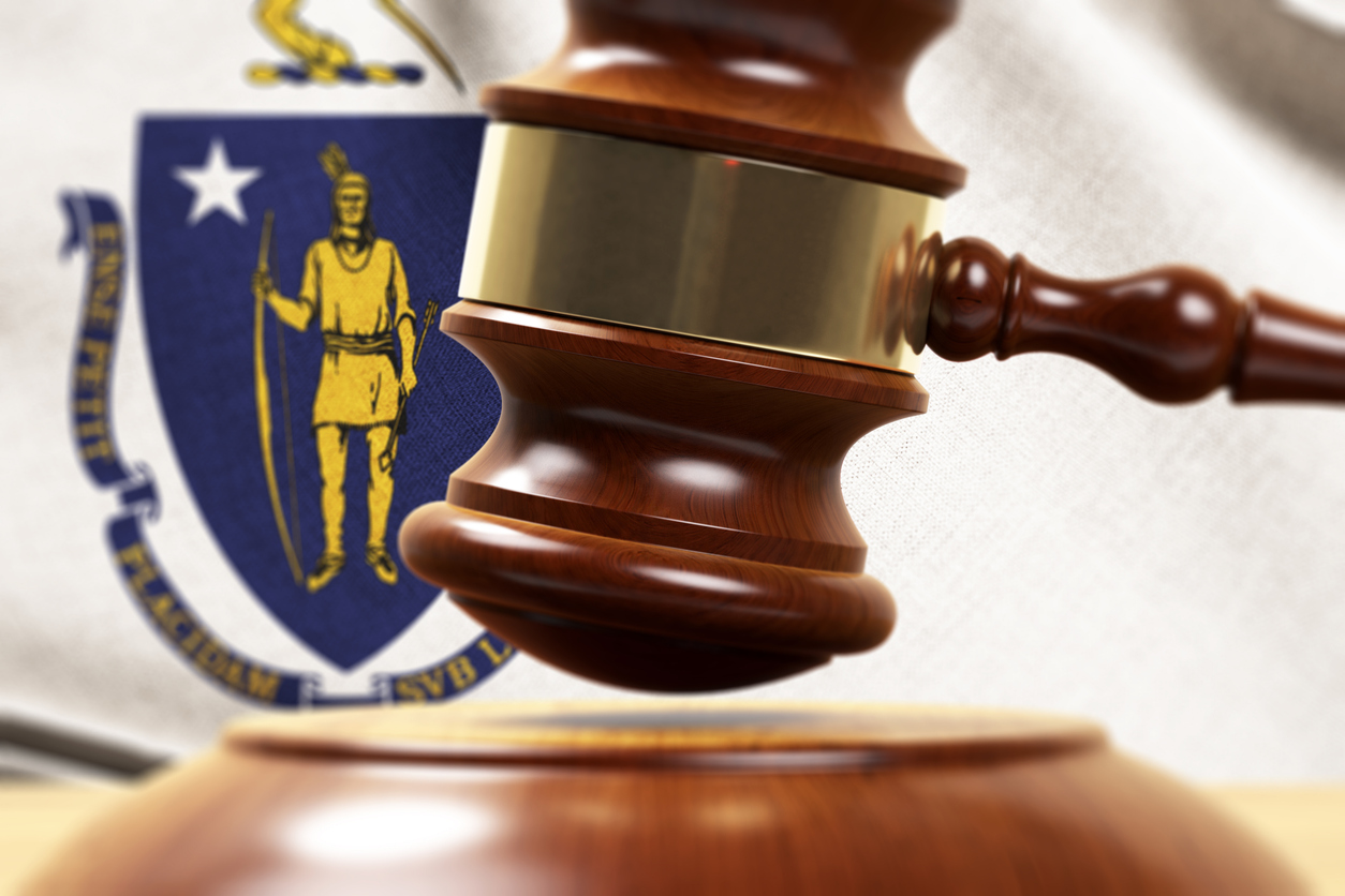 Wood Gavel Standing Front Of the Massachusetts Flag Closeup 3d Render Focused image